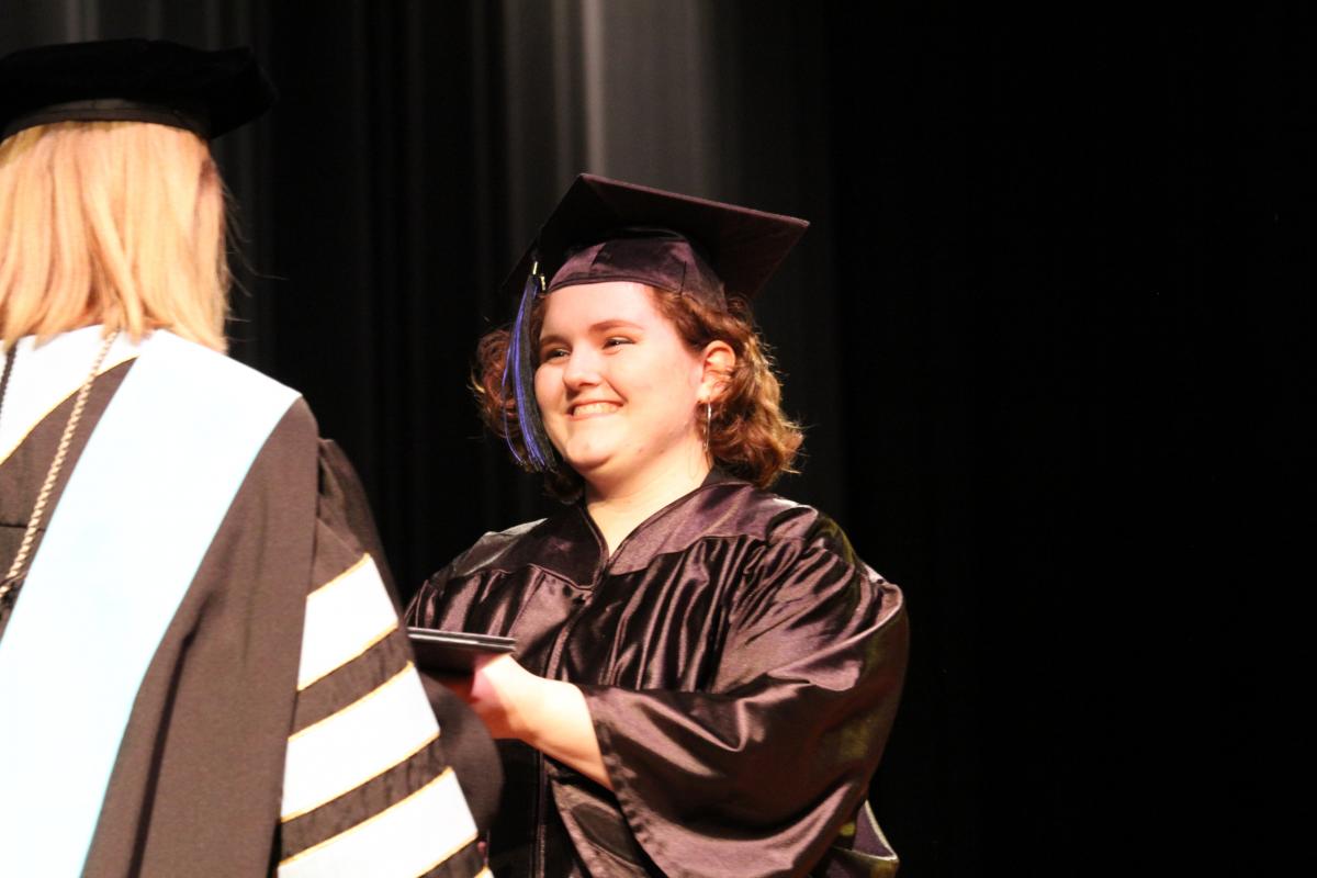 Arissa Farmer receiving her diploma. 